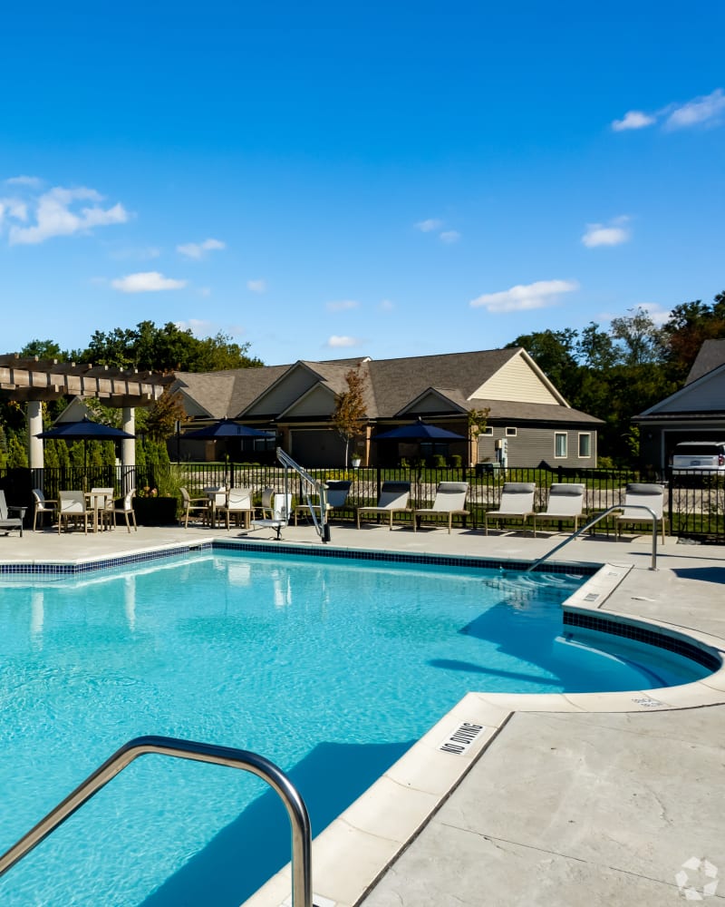 Swimming pool and lounge chairs at Encore at Deerhill in Clarkston, Michigan