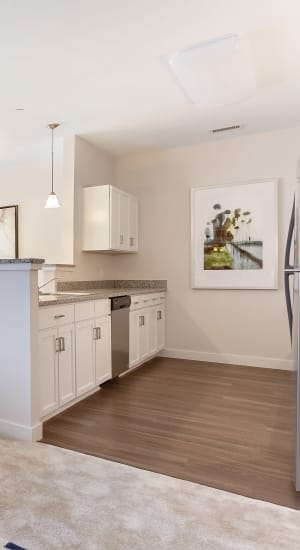 Kitchen with wood style flooring at Gateway Commons in East Lyme, Connecticut