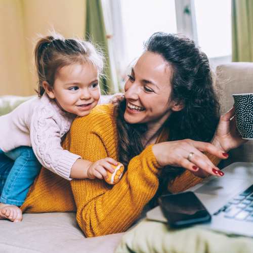 Resident having a good time with her daughter at Paddock Club Apartments in Florence, Kentucky