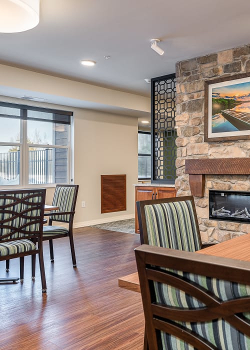 Common area with a fireplace at The Pillars of Hermantown in Hermantown, Minnesota