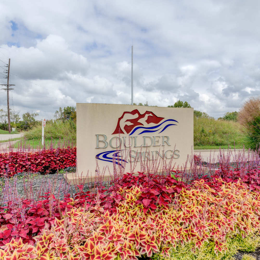 Charming entrance with name board at Boulder Springs in Maryland Heights, Missouri