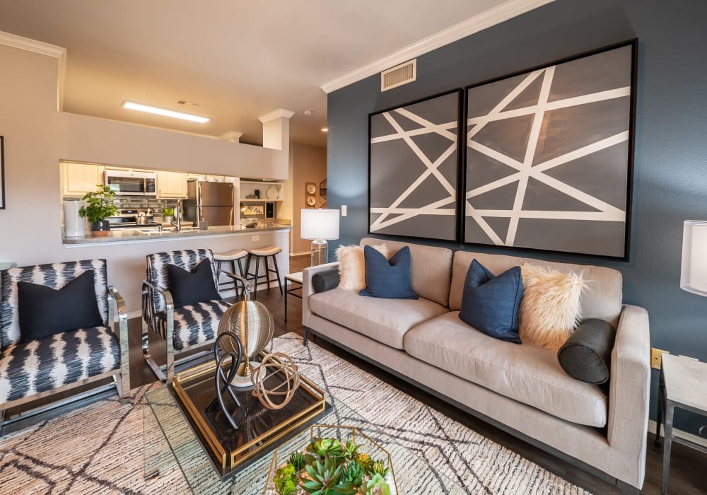 Well-decorated open-concept living space in a model home at 23Hundred @ Ridgeview in Plano, Texas