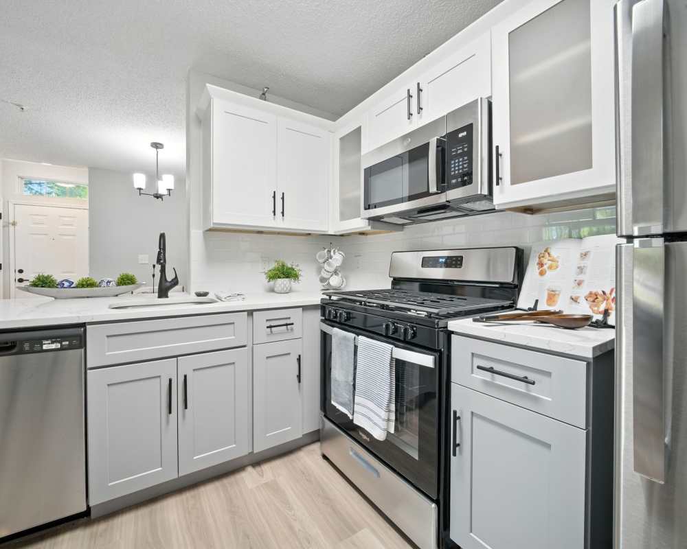 Modern kitchen appliances and cabinetry at Vista Point Apartments in Wappingers Falls, New York