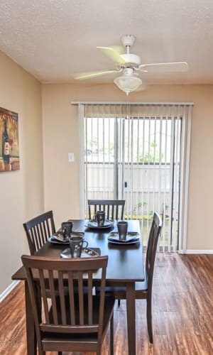 Dining area with faux wood floors at River Ranch in Sherman, Texas