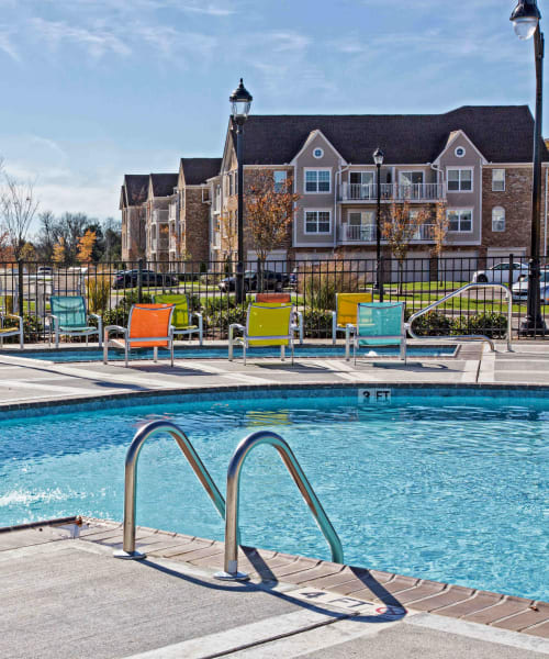 Outdoor swimming pool and expansive pool deck at Arbor Brook in Murfreesboro, Tennessee