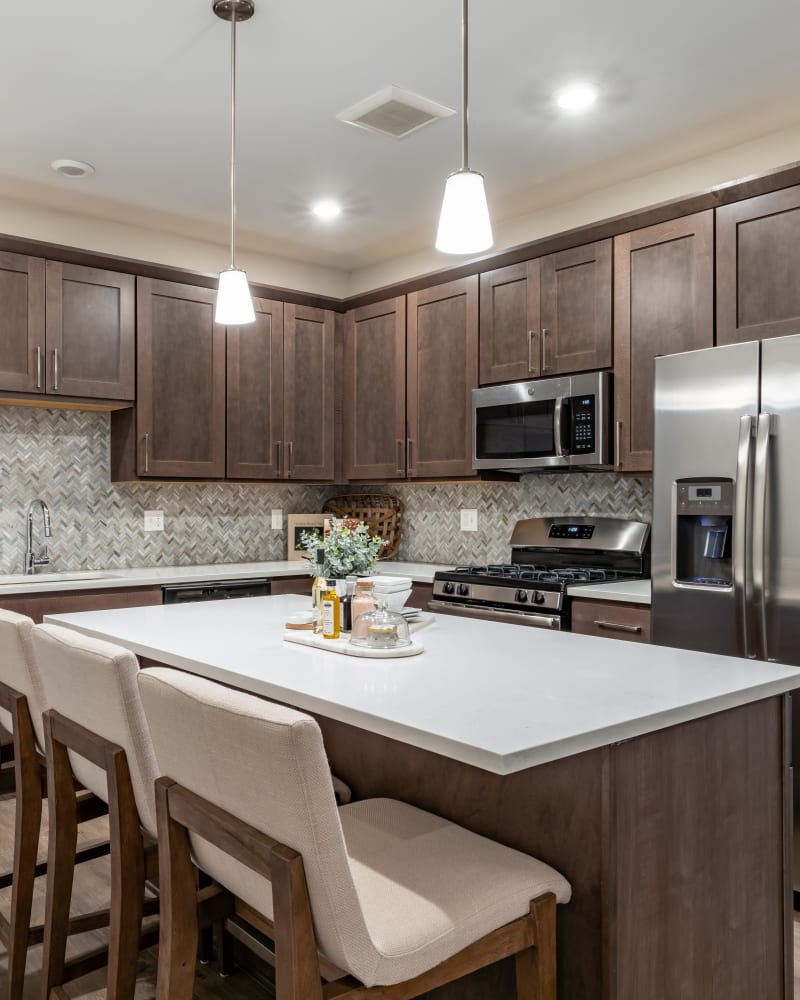 Beautiful kitchen with an island at Encore at Deerhill in Clarkston, Michigan