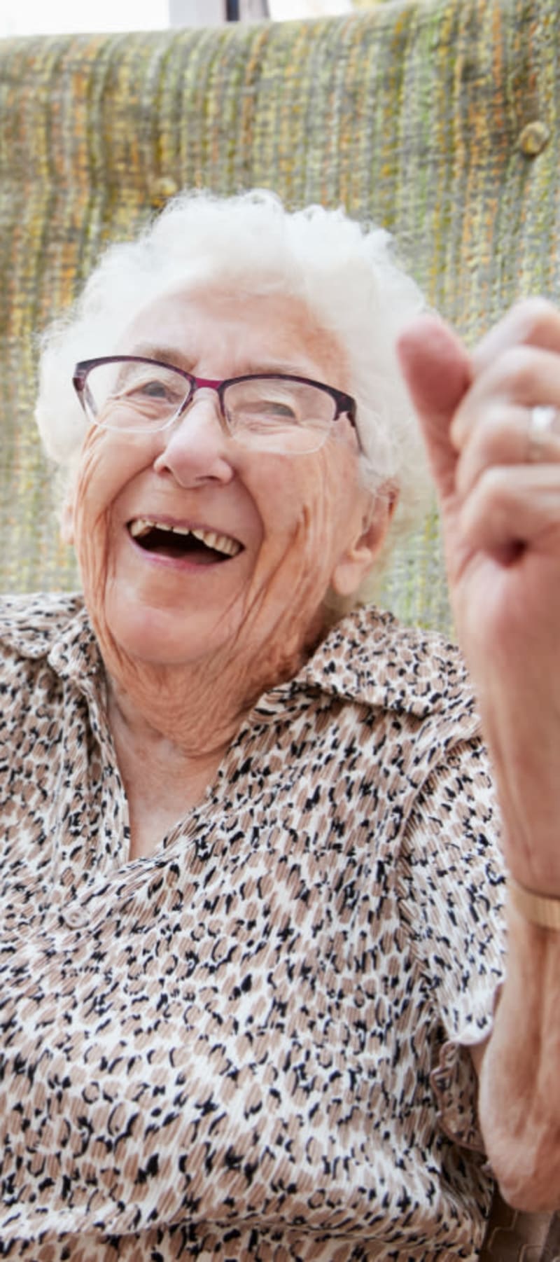 Resident laughing and cheering at Geneva Lake Manor in Lake Geneva, Wisconsin