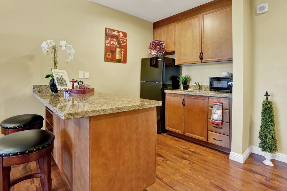 Elegant kitchen in senior living apartment at Estancia Del Sol in Corona, California