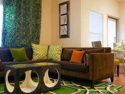 Living room of a model home with hardwood-style floors at The BLVD in San Angelo, Texas
