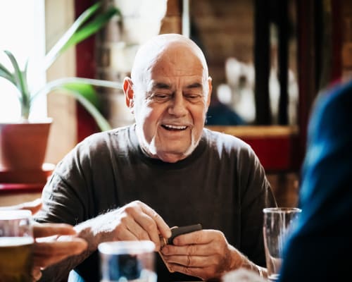 A resident about to play a hand at cards at Avion Point Seniors in Charlotte, North Carolina