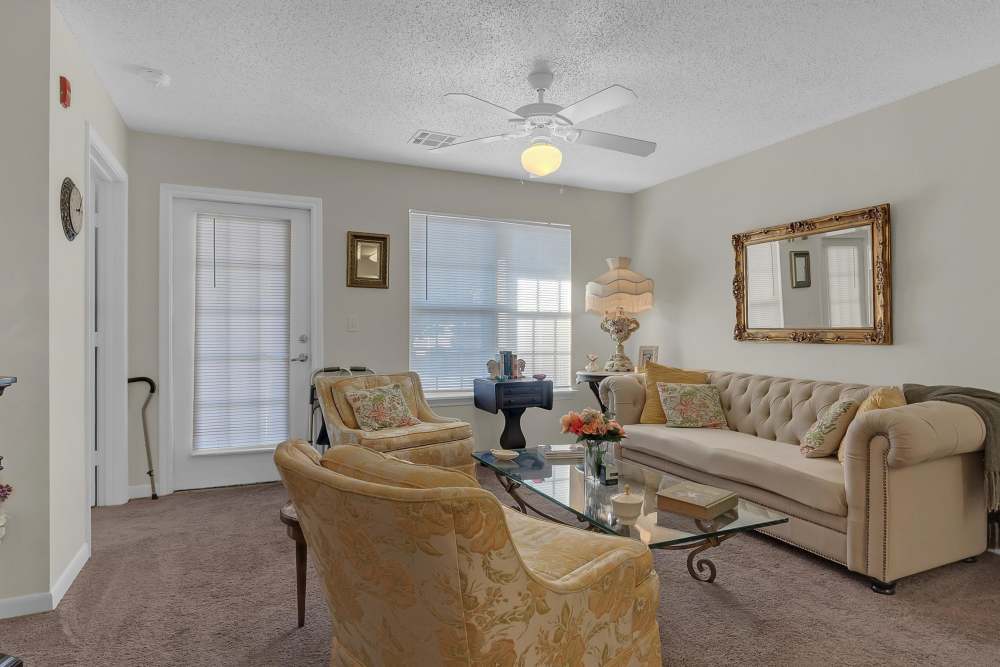 Living room with large sofa at Hartford Villas in Broken Arrow, Oklahoma