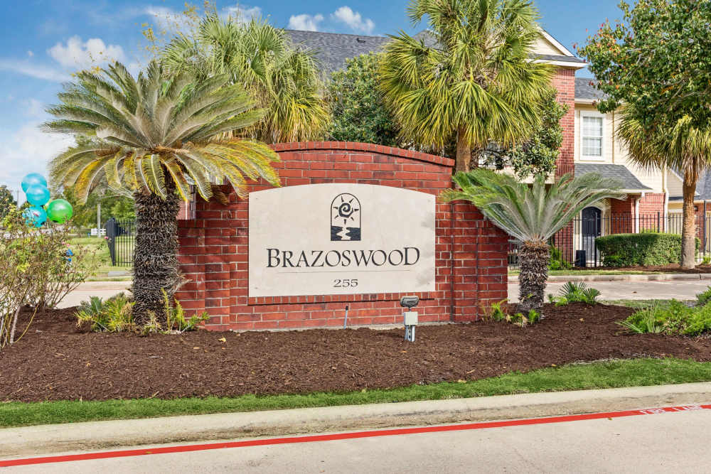 Signage of Brazoswood Apartments in Clute, Texas
