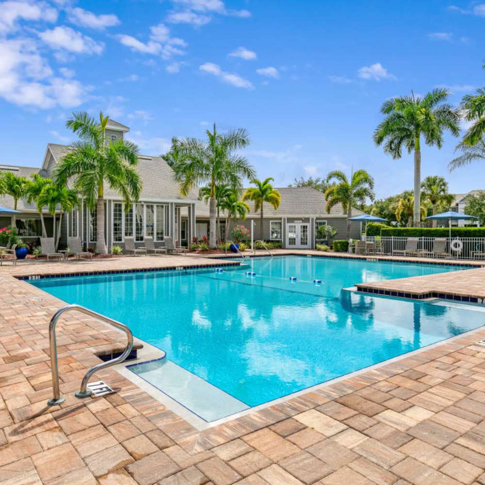 A swimming pool at Woodmere Apartments of Venice in Venice, Florida