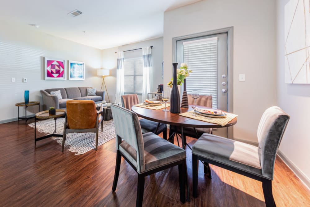 Dining room with wood style flooring at Marquis at Katy in Katy, Texas