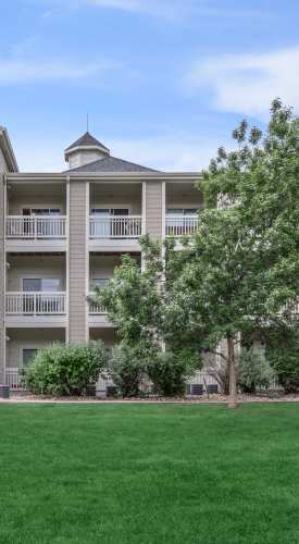 Property exterior with a lawn in the front at One Belmar Place in Lakewood,Colorado