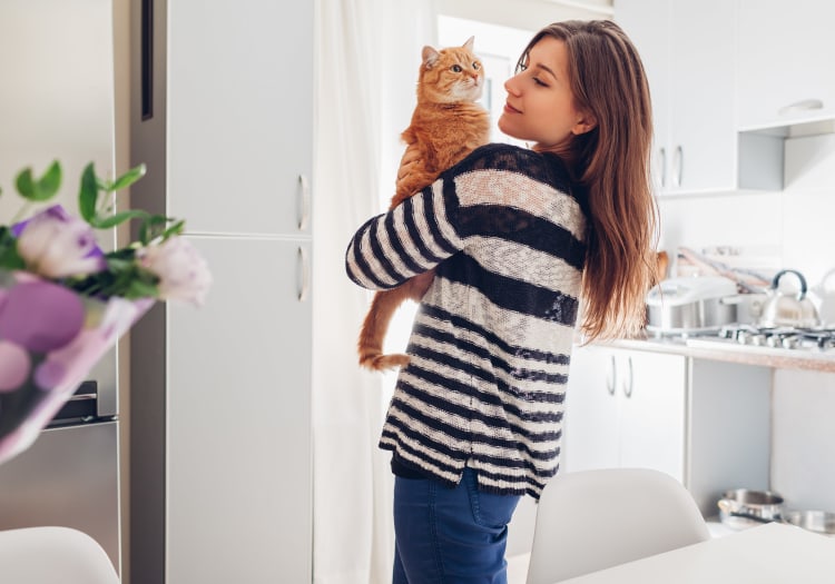 Cat and its owner in their new home at The Establishment at 1800 in Missouri City, Texas