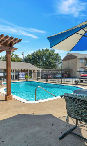 Swimming pool and deck at Franciscan Apartments in Garland, Texas