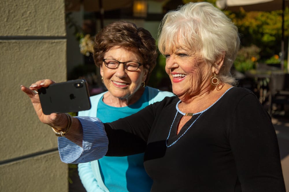 Residents taking a selfie at senior living in Monterey