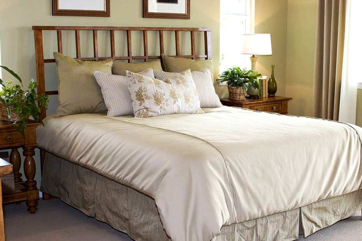 A comfortable and well decorated bed at Brightwater Senior Living of Linden Ridge in Winnipeg, Manitoba