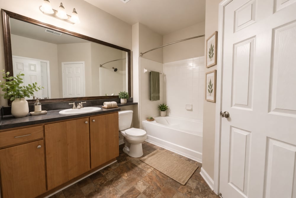 Large well lit bathroom with garden tub at Crescent Park Commons in Greer, South Carolina