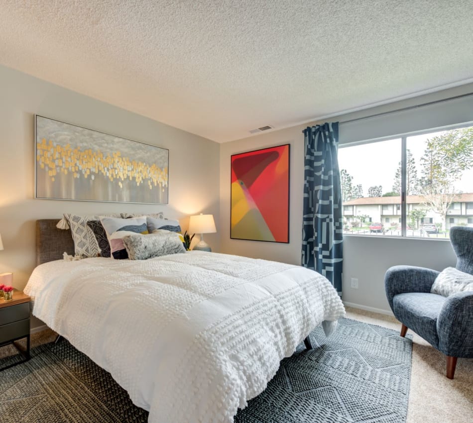 Eclectic decor in the large and bright bedroom of a model home at Sofi Ventura in Ventura, California 