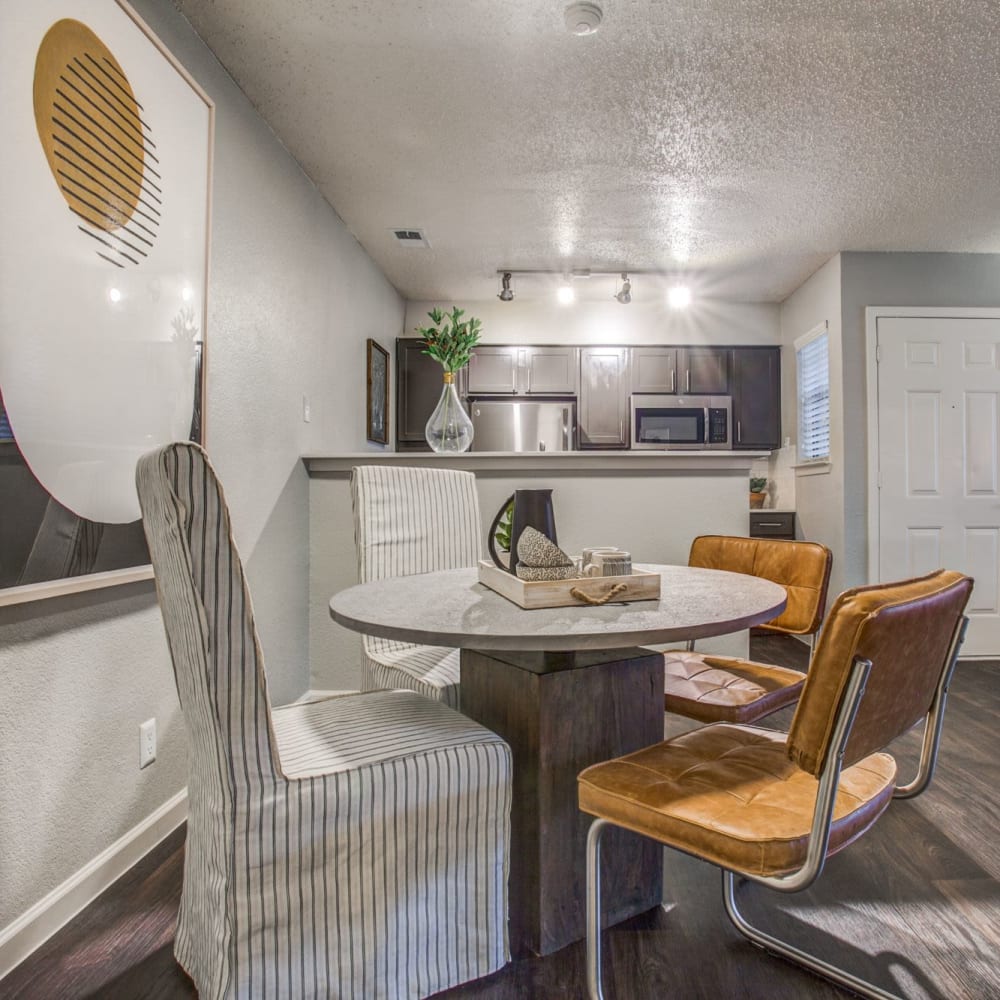 Resident living room with ceiling fan at The Reese at Eastchase in Fort Worth, Texas