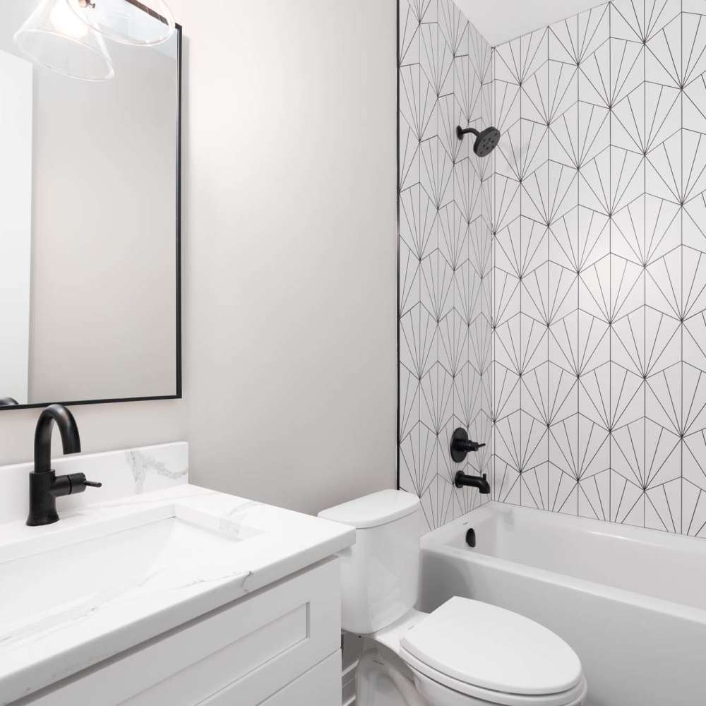 Bright bathroom with bathtub at Aven Residences in Houston, Texas
