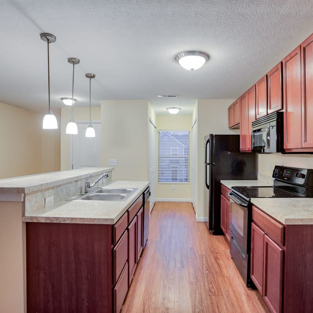 Kitchen with wood-style flooring at Lancaster Midtown, Lancaster, Ohio