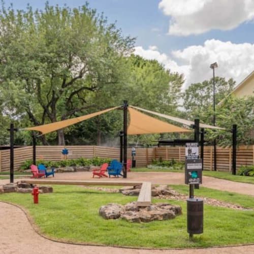 Dog park with sun shade at Oaks of Timbergrove in Houston, Texas