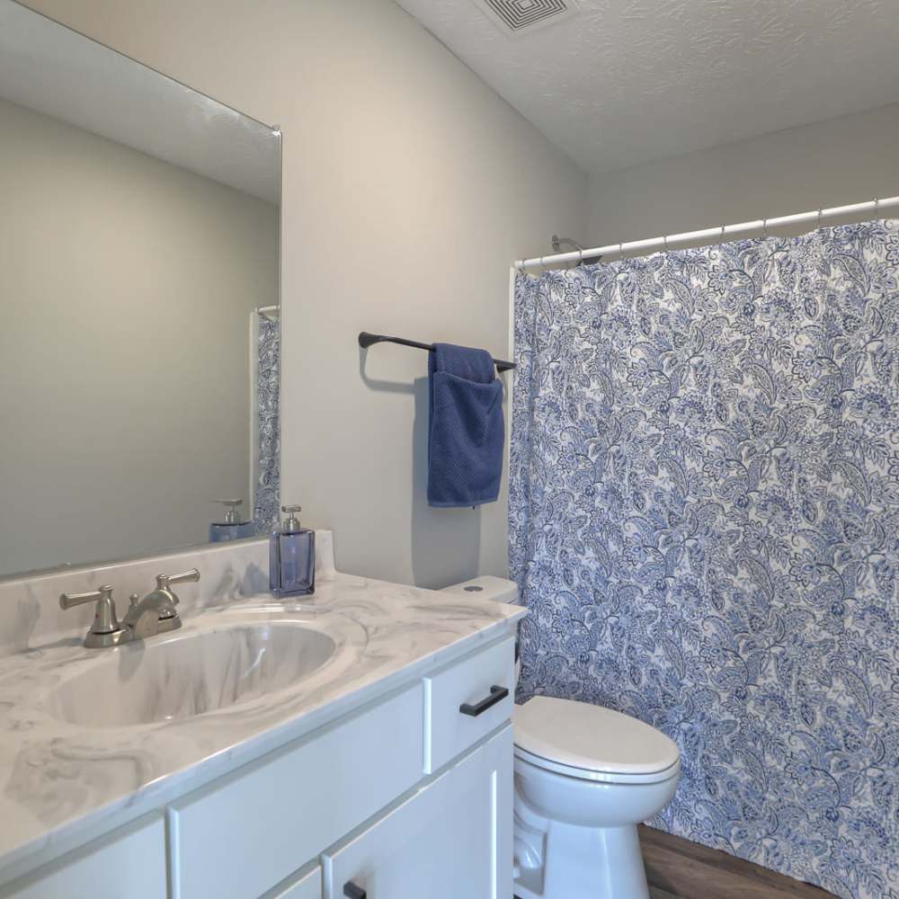 Bathroom with bathtub at Village Lake Townhomes in Smyrna, Tennessee