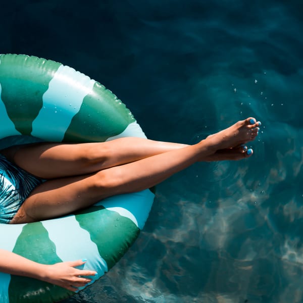 A resident floating in the salt water pool at Attain Downtown, Norfolk, Virginia