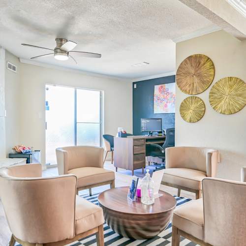 Living room with hard-wood style flooring at Woodside Flats in Dallas, Texas, 
