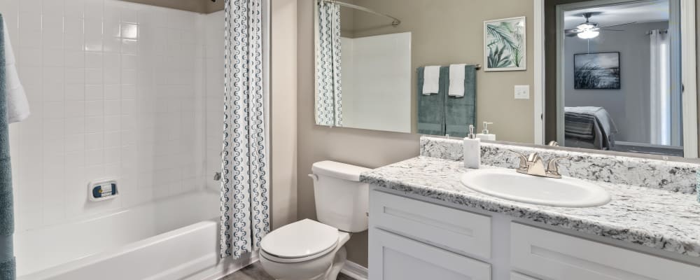 An apartment bathroom with a large tub at Arbor Gates in Fairhope, Alabama