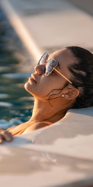 Resident enjoying the luxurious pool at 4000 Hulen in Fort Worth, Texas
