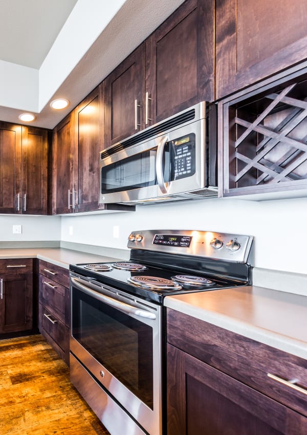 Kitchen with stainless steel appliances at Copperline at Point Ruston in Tacoma, Washington