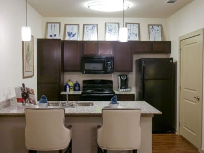 Gourmet kitchen with granite countertops at Anatole on MacArthur in Oklahoma City, Oklahoma