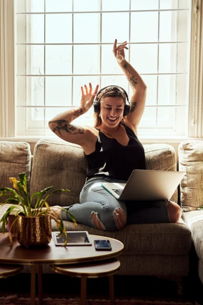 Resident listening to music in the living room of her home at Argon in Oklahoma City, Oklahoma