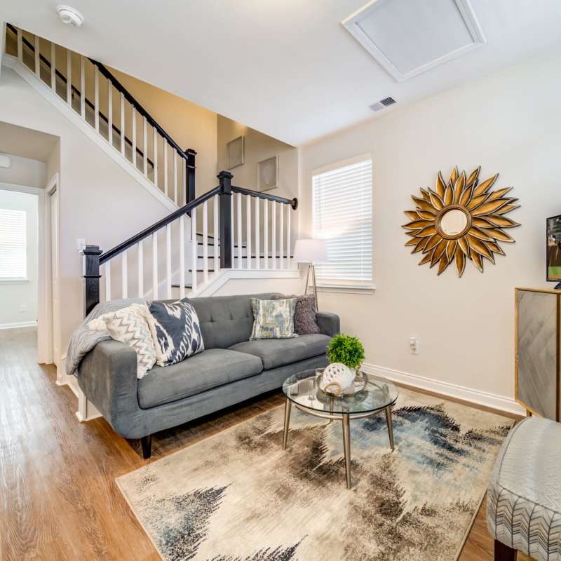 Modern vibrant living room with couch at Seaglass Cottage in North Myrtle Beach, South Carolina