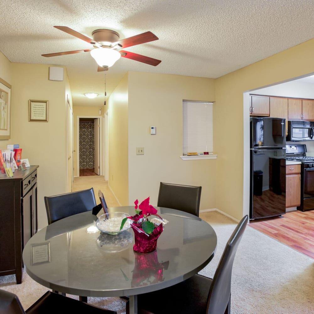 Apartment with dining room table at Ravenna Woods, Twinsburg, Ohio