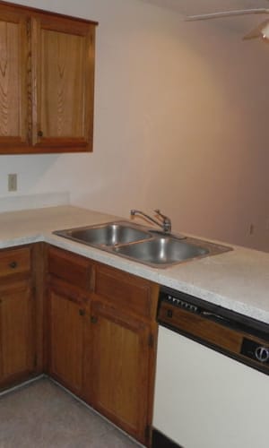 Fully equipped kitchen with the view of the living room at Highland Oaks in Duncanville, Texas