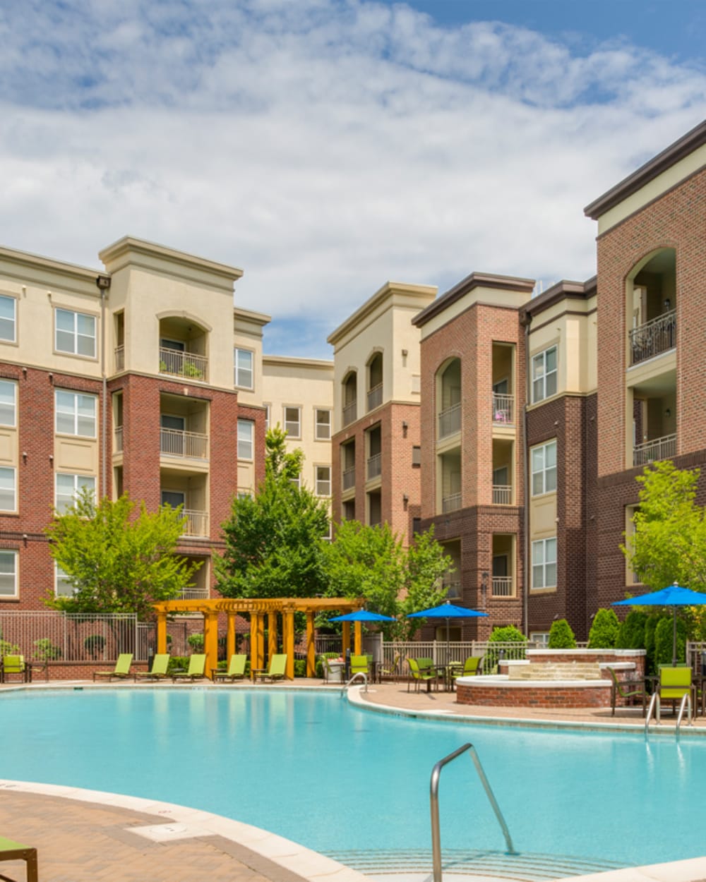 Pool surrounded by lounge chairs at 17 Barkley in Gaithersburg, Maryland