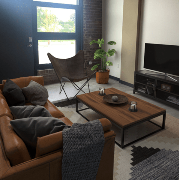 Living room with television at Mojud Lofts in Greensboro, North Carolina