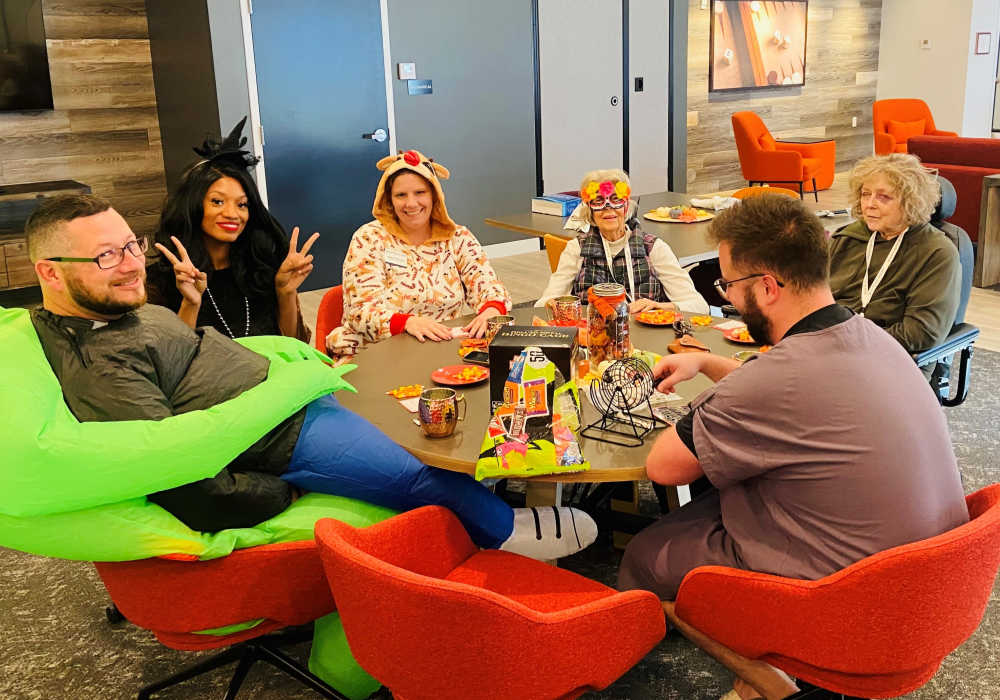 Residents gathered with family at a table at Mission Ridge in Springfield, Missouri