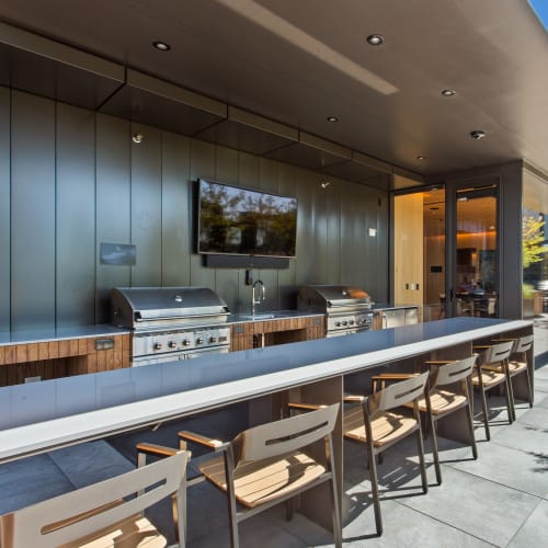 Outdoor grilling area on the roof deck at The Residences at 11W in Portland, Oregon