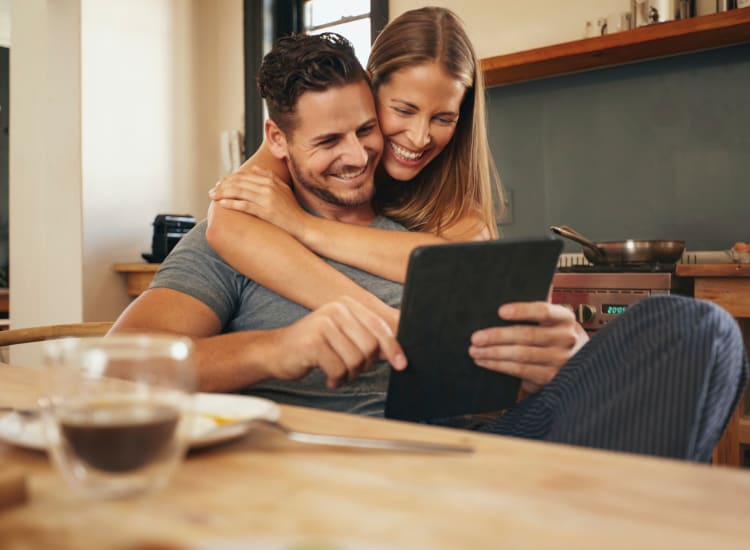 Couple hugging in their home at The Nathaniel in Rochester, New York