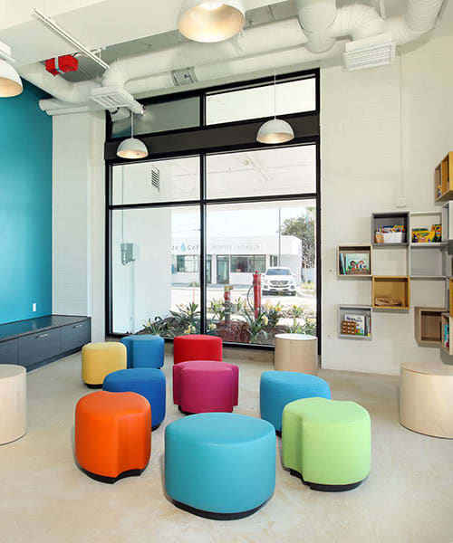 Colorful stools in clubhouse at La Placita Cinco, Santa Ana, California