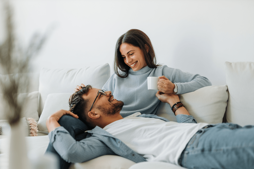 Couple relaxing in their new home at Stoneridge at Mark Center Apartment Homes in Alexandria, Virginia