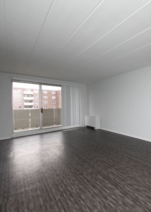 Living room space with sliding glass door to balcony at Parc at Cherry Hill in Cherry Hill, New Jersey