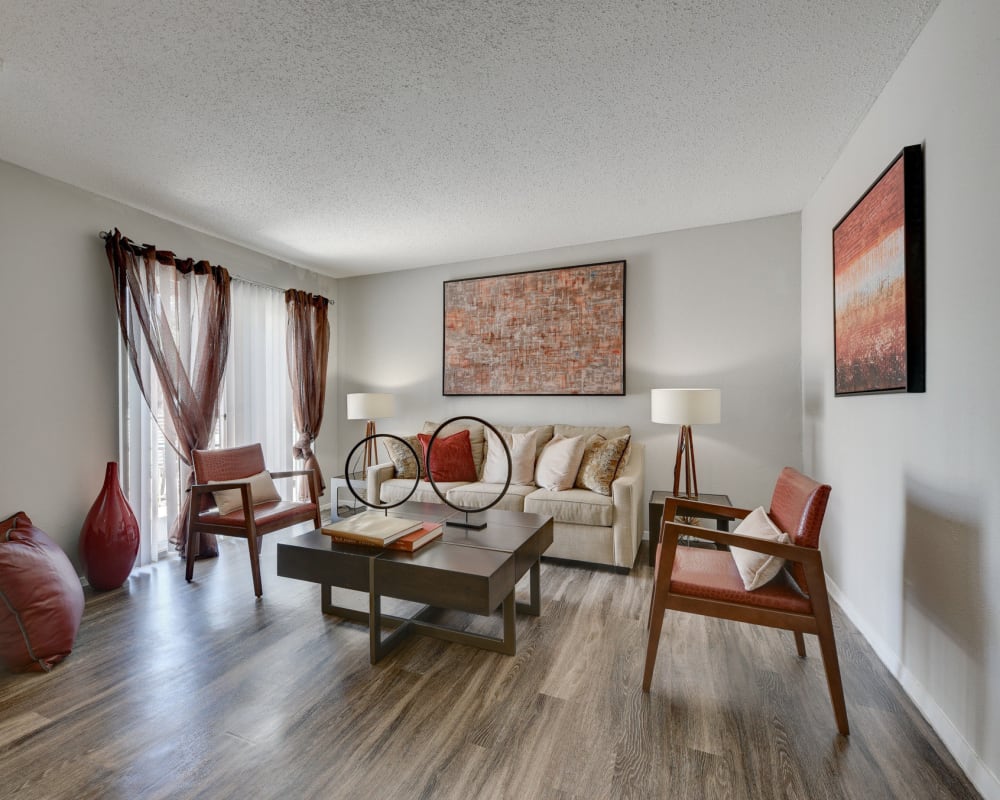 Furnished dining room with wood-style flooring at The Fredd Townhomes in San Antonio, Texas