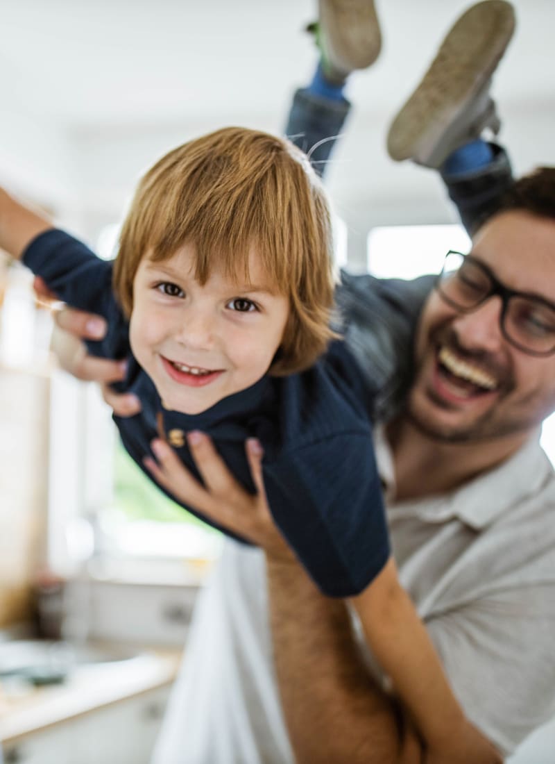 Resident playing with his son at Marquis at Bellaire Ranch in Fort Worth, Texas